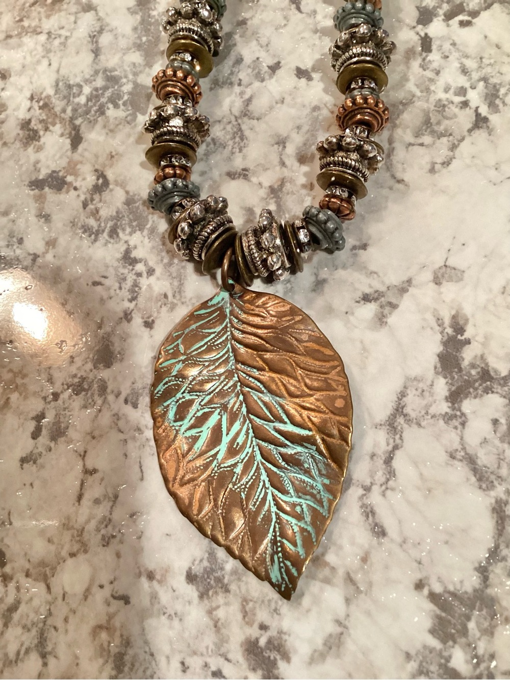 Artisan Crafted Bohemian Brown and Turquoise Metal Leaf Pendant Necklace - Picture 2 of 7
